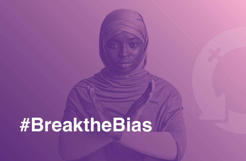 Image of woman with hijab reading #breakthe bias