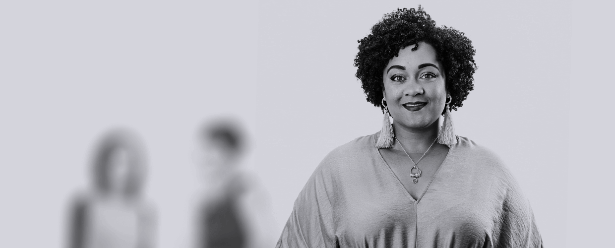 A headshot of employee, Jade Beckles, the GatenbySanderson Diversity and Inclusion advisor, smiling to camera