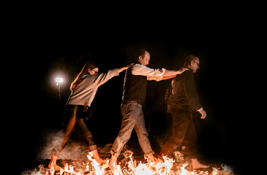 Photo of 3 GatenbySanderson colleagues walking on fire
