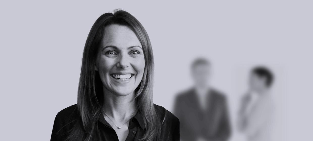 A headshot of a GatenbySanderson employee smiling to camera