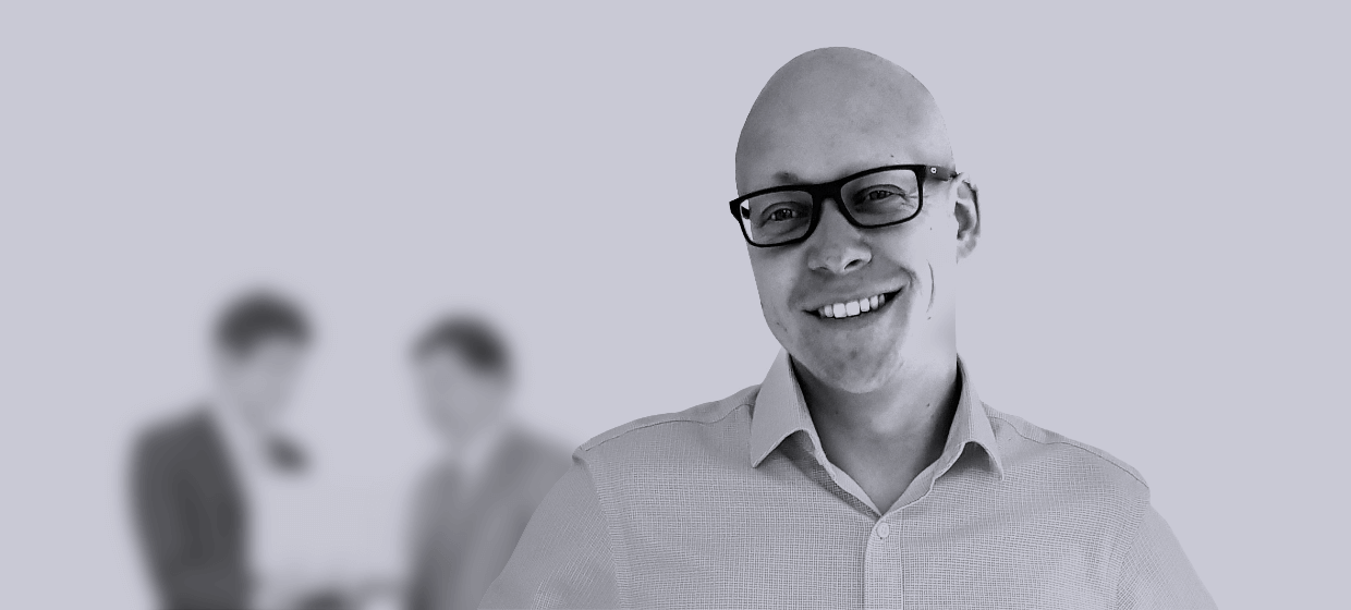 A headshot of a GatenbySanderson employee smiling to camera