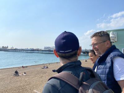 people overlooking brighton beach
