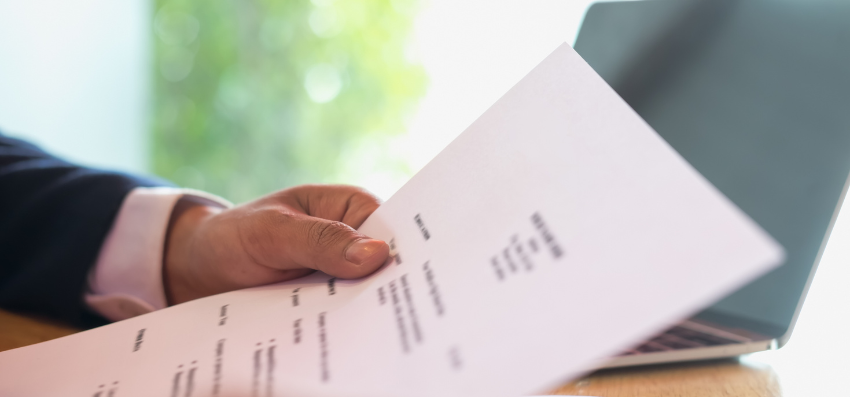 hand holding a CV