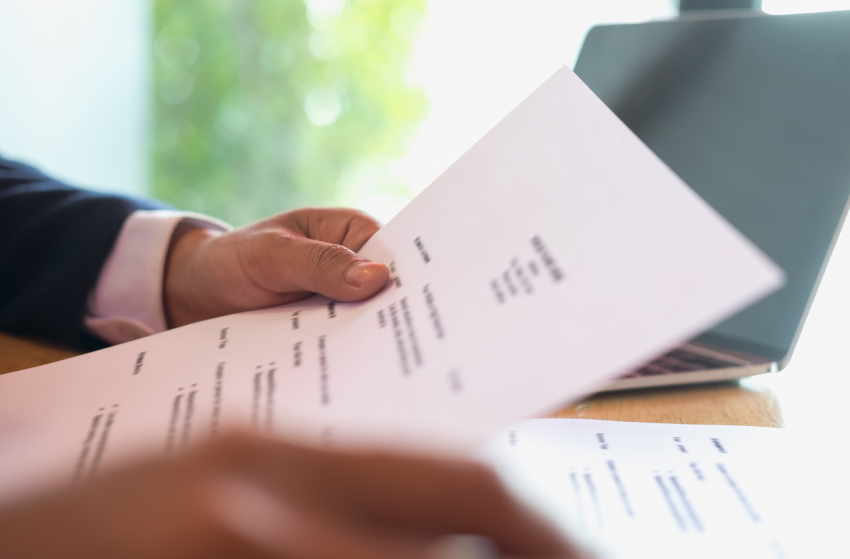 hand holding a CV