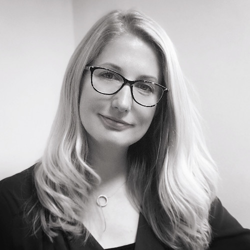 Headshot of, Alison, Chair of Disability affinity group at GatenbySanderson, looking off camera
